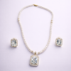 White pearl beaded statement necklace set with crystal pendant and matching earrings by Elysian Elite