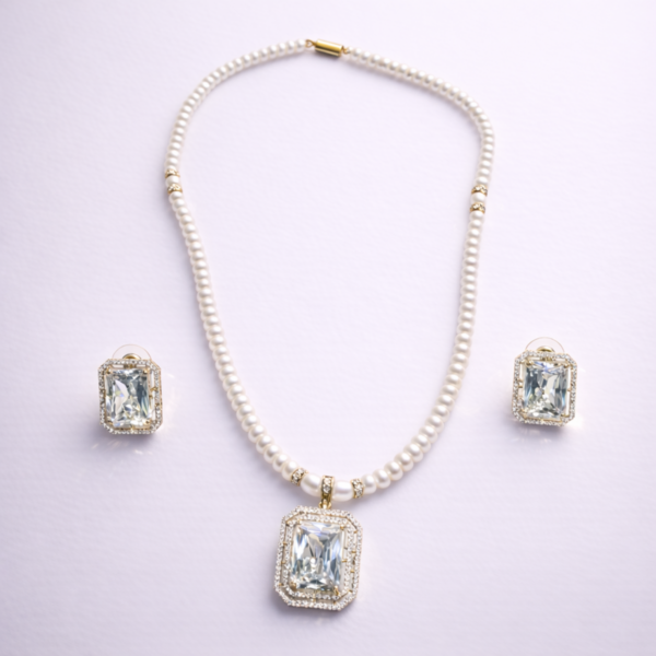 White pearl beaded statement necklace set with crystal pendant and matching earrings by Elysian Elite