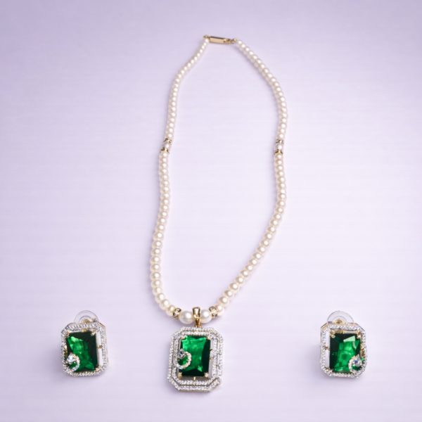 White pearl beaded statement necklace set with green crystal pendant and matching earrings by Elysian Elite