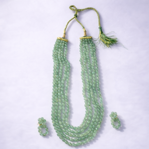 Mint green multi strand beaded statement necklace set with matching earrings by Elysian Elite