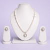 Silver-tone freshwater pearl necklace set with circular halo pendant and matching pearl stud earrings on white bust display